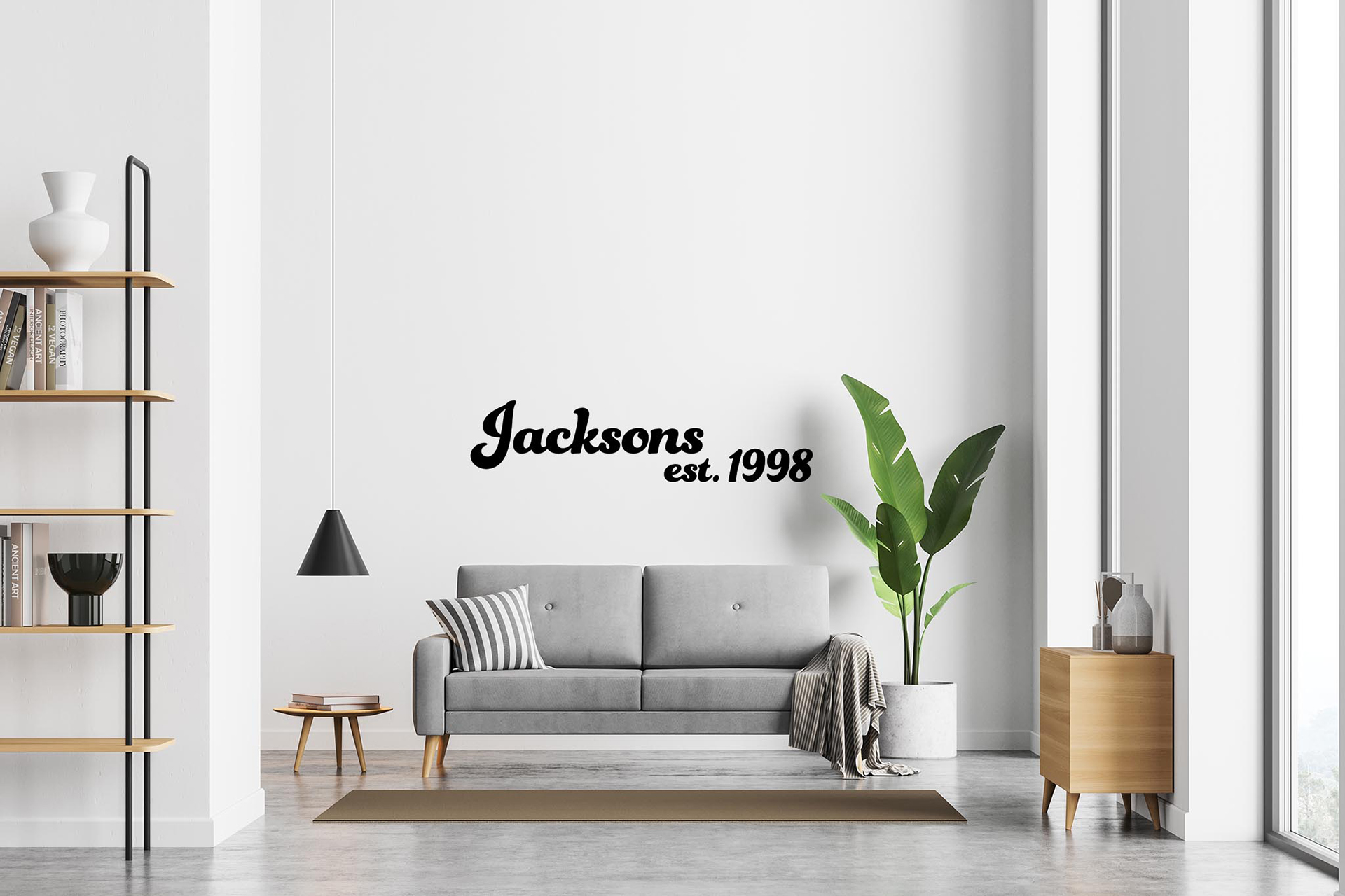 Living room with black Jacksons wall decal using removable vinyl